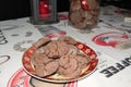 Delicious homemade cacao christmas cookies and a jar and candle in the back Royalty Free Stock Photo