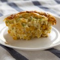 Delicious Homemade Cheddar Corn Pudding Casserole on a white plate, side view. Close-up Royalty Free Stock Photo