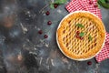 Delicious Homemade Cherry Pie, Flaky Crust, piece on a plate and the whole homemade cherry pie, place for text, top view Royalty Free Stock Photo