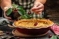 Delicious Homemade Cherry Pie, Flaky Crust, piece on a plate and the whole homemade cherry pie, place for text, top view Royalty Free Stock Photo