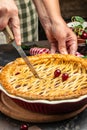 Delicious Homemade Cherry Pie, Flaky Crust, piece on a plate and the whole homemade cherry pie, place for text, top view Royalty Free Stock Photo