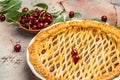 Delicious Homemade Cherry Pie, Flaky Crust, piece on a plate and the whole homemade cherry pie, place for text, top view Royalty Free Stock Photo