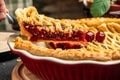 Delicious Homemade Cherry Pie, Flaky Crust, piece on a plate and the whole homemade cherry pie, place for text, top view Royalty Free Stock Photo