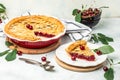 Delicious Homemade Cherry Pie, Flaky Crust, piece on a plate and the whole homemade cherry pie. top view Royalty Free Stock Photo