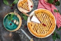 Delicious Homemade Cherry Pie, Flaky Crust, piece on a plate and the whole homemade cherry pie, top view Royalty Free Stock Photo