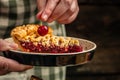 Delicious Homemade Cherry Pie, Flaky Crust, piece on a plate and the whole homemade cherry pie, top view Royalty Free Stock Photo