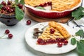 Delicious Homemade Cherry Pie, Flaky Crust, piece on a plate and the whole homemade cherry pie, top view Royalty Free Stock Photo