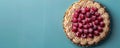 Delicious Homemade Cherry Tart with Whipped Cream Rosettes on a Fresh, Blue Background Perfect for Baking Enthusiasts and Dessert