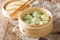 Delicious homemade chinese cuisine Steamed Baozi with bamboo steamer close-up. Horizontal Royalty Free Stock Photo