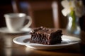 Delicious homemade chocolate brownie isolated on dark background. AI generated. Selective focus