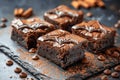 Delicious Homemade Chocolate Brownies with Chocolate Chips and Cocoa Powder on Dark Slate Background, Freshly Baked Royalty Free Stock Photo