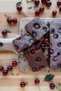 Chocolate cake with sour cherries on light wooden table Royalty Free Stock Photo