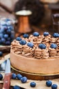 Delicious homemade chocolate cheesecake decorated with fresh blu Royalty Free Stock Photo