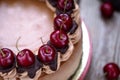 Delicious homemade chocolate cheesecake decorated with cherry Royalty Free Stock Photo