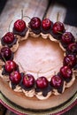 Delicious homemade chocolate cheesecake decorated with fresh cherry Royalty Free Stock Photo