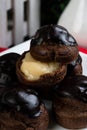 Homemade chocolate cream puffs with Bavarian filling