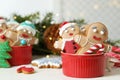 Delicious homemade Christmas cookies in bowl on white wooden table against blurred festive lights. Space for text Royalty Free Stock Photo