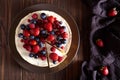 Delicious Homemade creamy mascarpone New York Cheesecake with berries on dark wooden table. Top viev.