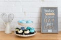 Delicious homemade cupcakes on the stand, cupcakes with fresh berries on the kitchen table. Bakery, confectionery concept