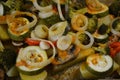 Potato wedges with healthy vegetables, zucchini, rings of onions, pieces of broccoli, slices of red bell pepper. Royalty Free Stock Photo