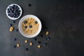 Delicious homemade granola in glass jar, fresh blueberries Healthy food sweet dessert snack. Diet nutrition concept