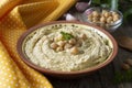 Delicious homemade hummus pasta with olive oil and chick-peas. Wooden table. Healthy food Royalty Free Stock Photo