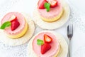 Delicious homemade mango strawberry cheesecake white background Copy space Selective focus Top view