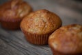 Delicious homemade muffins over wooden board