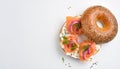 A delicious homemade new york city jewish deli style poppy sesame seed bagel with cream cheese and lox or smoked fish both halves Royalty Free Stock Photo