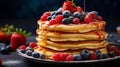 Delicious homemade pancakes with fresh berries and maple syrup for breakfast, copy space available Royalty Free Stock Photo