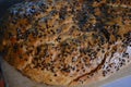 Beautiful very hearty bread homemade recipe. Brown bread with crispy crust, black caraway seeds and brown flax kernels. Royalty Free Stock Photo