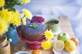 Delicious homemade pastries with poppy seeds and fresh berries on the breakfast table. A big bouquet of yellow flowers. Autumn Royalty Free Stock Photo