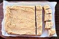 Delicious Homemade Peanut Butter Fudge over Cutting Board Royalty Free Stock Photo