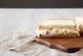 Delicious Homemade Pimento Cheese Sandwich with chips on a rustic wooden board, side view. Copy space