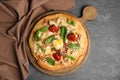 Delicious homemade pita pizza on grey table, top view