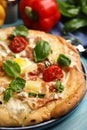 Delicious homemade pita pizza on light blue wooden table, closeup