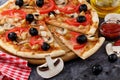 Delicious homemade pizza with mushrooms and chicken and olives