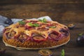 Delicious homemade plum pie on rustic background Royalty Free Stock Photo