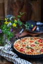 Delicious homemade quiche lorraine with chicken, tomato, mushrooms and cheese Royalty Free Stock Photo