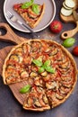 Quiche open tart pie with chicken meat tomatoes, eggplant and cheese