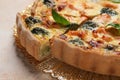 Delicious homemade quiche with salmon and broccoli on beige table, closeup Royalty Free Stock Photo