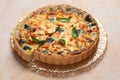 Delicious homemade quiche with salmon and broccoli on beige table Royalty Free Stock Photo