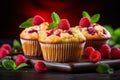 Delicious homemade raspberry muffins on blurred background with copy space for text placement Royalty Free Stock Photo