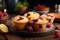 Delicious homemade raspberry muffins in a cozy kitchen, with a blurred background and text space Royalty Free Stock Photo