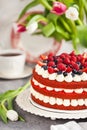 Delicious homemade red velvet cake decorated with cream and fresh berries Royalty Free Stock Photo