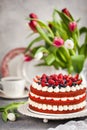 Delicious homemade red velvet cake decorated with cream and fresh berries Royalty Free Stock Photo