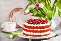 Delicious homemade red velvet cake decorated with cream and fresh berries Royalty Free Stock Photo