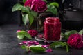 Delicious homemade rose jam in jar with rose flowers