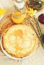 Delicious homemade stack of russian-style pancakes on kitchen table.