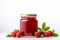 Delicious homemade strawberry jam in a glass jar, isolated on white background with ample text space Royalty Free Stock Photo